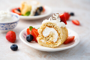 Wall Mural - Homemade Swiss roll with whipped cream and berries