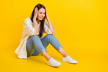 Poster - Full length profile photo of stressed unsatisfied person sit floor hands touch head empty space isolated on yellow color background