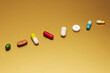 © fStop - Still life arrangement variety of medication pills and capsules on yellow background