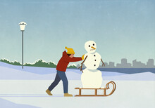 Woman Pushing Snowman On Sled In Snowy Winter City Park
