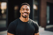 © ADDICTIVE STOCK - Generative AI illustration of cheerful black man wearing a black t-shirt smiles radiantly against a backdrop of modern buildings