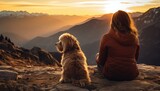 Fototapeta  - Kobieta z psem podziwiająca wschód słońca w górach. 