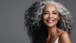 © Ladanifer - Portrait of smiling mature beautiful black woman over gray background. Beauty, cosmetics skincare and dental advertising concept. Generative AI.