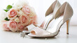 Composition with wedding high heel shoes and flowers on white background