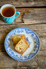 Sticker - Pieces of sweet bread. Wooden background, side view.