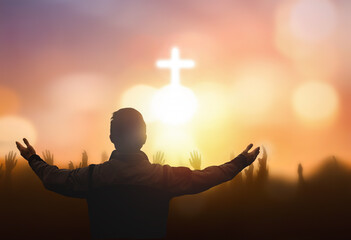 Wall Mural - soft focus of Christian worship with raised hand on white cross background