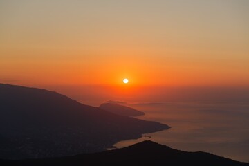 Poster - Beautiful mountain landscape with sunset sky with sea