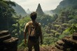 A man hiker stands in front of an ancient abandoned city in the jungle. view from the back