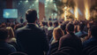 © Synaptic Studio - Rear view of people in audience at a business event in a conference hall