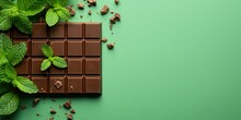 Organic Mint Chocolate. Chocolate Spot With Mint Leaves And Square Pieces Of Chocolate On Light Green Background. Chocolate Product. Healthy Food. Flat Lay, Copy Space.