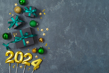 Wall Mural - New Year 2024 party background with decorations and black gift boxes. Top view, flat lay