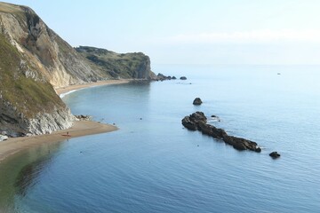 Poster - Aerial view of the picturesque Man o War Bay, featuring a tranquil beach