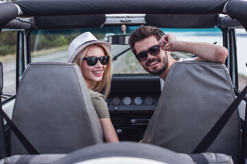 Canvas Print - Couple travelling by car