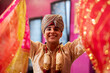 young indian teenager looking at camera while holding bollywood dance veils