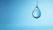 Closeup of one single water drop droplet isolated on blue background 