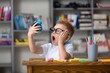 © BillionPhotos.com - School boy dreaming with alarm clock in classroom