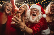 © pixelrain - Funny Santa having fun with santa dressed mature women at a Christmas party