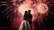 © bmf-foto.de - Silhouettes of a bride and groom in front of a nighttime fireworks display
