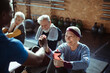 © Davor - Smiling senior woman working out with friends in gym