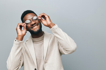 Wall Mural - Cheerful african man wearing glasses jean jacket having white snow smile pointing fingers aside at copy space for your text advertisement, advertise teeth whitening or eyewear store good offer concept