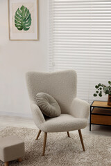 Wall Mural - Comfortable armchair, table and houseplant in living room. Interior design