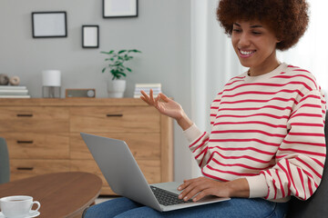 Poster - Beautiful young woman having video chat via laptop in room