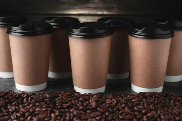 Canvas Print - Coffee to go. Many paper cups and roasted beans on table