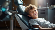 A Cute Brave Smiling Child Is Sitting In A Dental Chair . World Dentist And Dental Hygiene Day