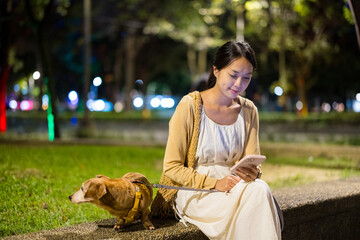 Wall Mural - Woman go out with dog in the evening