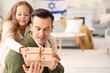 Little girl with her father and gift celebrating Hanukkah at home