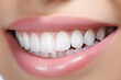 Closeup of a young woman smiling with white teeth. Dentistry concept.