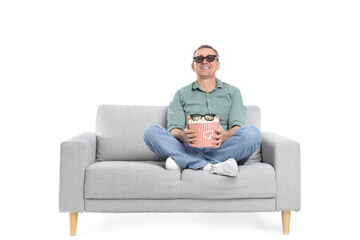 Poster - Mature man in 3D glasses with popcorn watching movie on sofa against white background