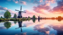 Panorama Landscape Windmills On Water Canal In Village. Colorful Spring Sunset In Netherlands, Europe