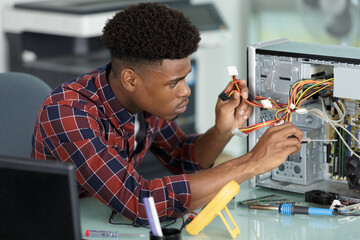 male technician repairing a computer