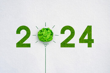 Wall Mural - Corporate Social Responsibility (CSR), eco-friendly business and environmental 2024 concept, Green crumpled paper light bulb on white background