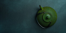 Traditional Japanese Teapot For Brewing Tea. On A Black Stone Background. Top View. Free Space For Text.