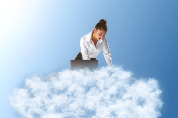 Poster - Young caucasian businesswoman using her laptop on cloud. Blue sky background. Dream big, business and strategy, forethought and vision concept.