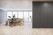 Modern coworking office interior with empty mock up place on wall, panoramic windows and city view, daylight, wooden flooring, furniture and decorative plant. 3D Rendering.