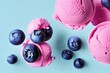 © Talhashahi - Delicious Blueberry ice cream balls isolated on Colorfull Background