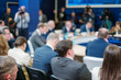 © Anton Gvozdikov - Back view of business professionals attending conference meeting in auditorium at export forum