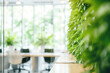Biophilic Design Office Spaces - Office interiors featuring living green walls and natural light for well-being at work - AI Generated