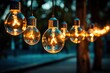 © nataliya_ua - light bulbs hanging on a wire outdoor
