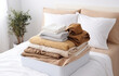 © Oleksiy - modern empty openned suitcase on white bed on white bedroom background
