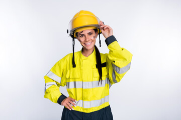 Poster - Photo of young attractive woman firefighter happy positive smile hand touch helmet isolated over white color background