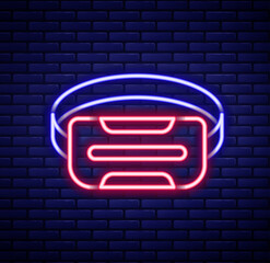 Wall Mural - Glowing neon line Virtual reality glasses icon isolated on brick wall background. Stereoscopic 3d vr mask. Optical head mounted display. Colorful outline concept. Vector