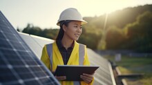 Female Engineer With Tablet For Inspection Maintenance Of Solar Photovoltaic Panels