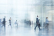 © agnes - Blur of people moving through a sleek office environment