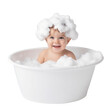Cute baby with foam on head bathing in tub