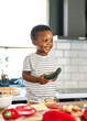 © Lumos sp - child family kitchen food boy son father breakfast happy together fun morning bonding healthy diet eating home black african american man happy kid game childhood cute parent preparing