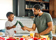 © Lumos sp - child family kitchen food boy son father breakfast happy together fun morning bonding healthy diet eating home black african american man happy kid game childhood cute parent preparing